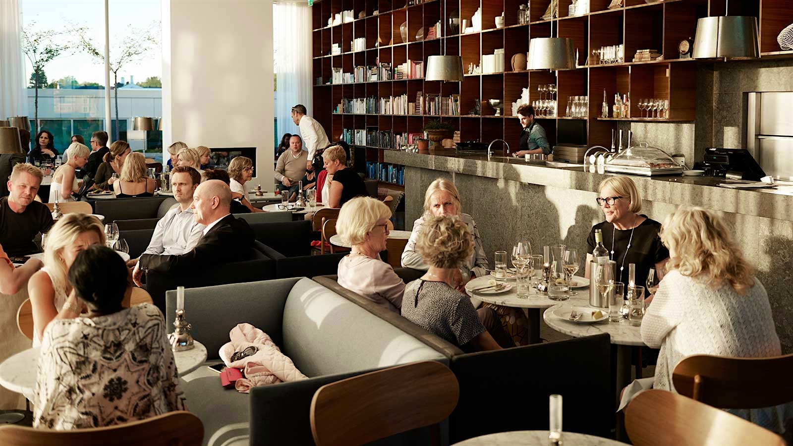 Guests in the dining room of PM and Vänner